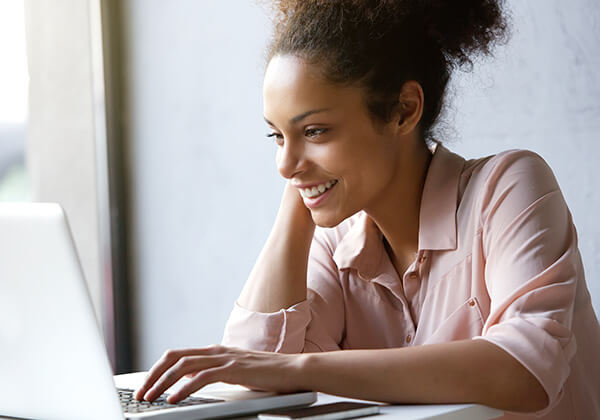 Woman smiling at screen